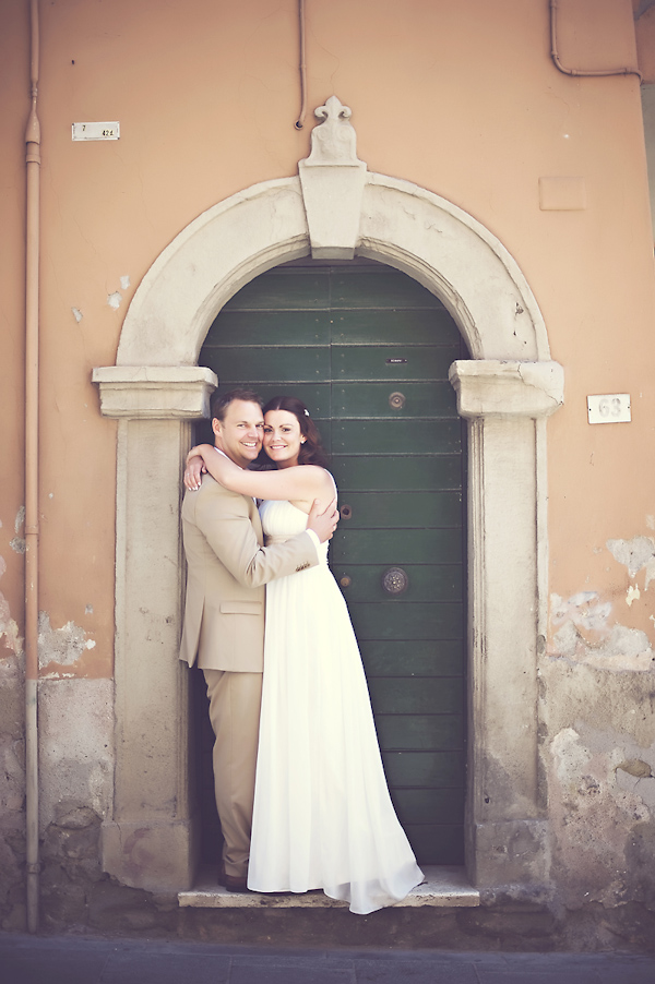 newlywed standing in doorway - wedding photo by top Rome based destination wedding photographer Rochelle Cheever, Rome Weddings Photography